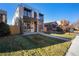 Modern three-story home with a light brick exterior and a rooftop deck at 357 S Franklin St, Denver, CO 80209