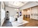 Elegant dining area with white chairs and a chandelier at 8860 S Quatar Ct, Aurora, CO 80016