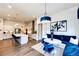 Breakfast nook with blue velvet seating and a modern chandelier at 8860 S Quatar Ct, Aurora, CO 80016