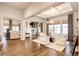 Bright dining area with hardwood floors and built-in shelving at 8860 S Quatar Ct, Aurora, CO 80016