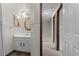 Bathroom with vanity and a hallway at 3061 W 92Nd Ave # 5C, Westminster, CO 80031