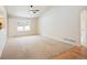 Spacious living room featuring hardwood and carpeted floors at 1631 Woodcock St, Berthoud, CO 80513