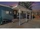 Covered back patio with exterior access and concrete flooring at 1024 Florence St, Aurora, CO 80010