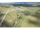 Aerial view of property showing a house, barn, and surrounding land at 8045 N Moore Rd, Littleton, CO 80125