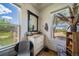 Bright bathroom with updated vanity and windows offering a view at 8045 N Moore Rd, Littleton, CO 80125