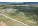 Aerial view of ranch property with riding arena and outbuildings at 8045 N Moore Rd, Littleton, CO 80125