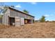 Large barn with open doors, showing equipment inside at 1251 Bailey Dr, Brighton, CO 80603