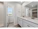 Double vanity bathroom with quartz countertop and shower at 3282 N Highlands Creek Pkwy, Aurora, CO 80019