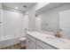 Clean bathroom with a bathtub, toilet and vanity with quartz countertop at 3282 N Highlands Creek Pkwy, Aurora, CO 80019