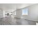 Open concept kitchen and living room with hardwood floors and island at 3282 N Highlands Creek Pkwy, Aurora, CO 80019