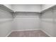 Walk-in closet with double hanging rods at 3282 N Highlands Creek Pkwy, Aurora, CO 80019