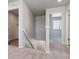 Upper hallway with carpet, linen closet, and bedrooms at 3282 N Highlands Creek Pkwy, Aurora, CO 80019