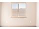 Simple bedroom with window offering an outdoor view at 12983 W Ida Ave # 203, Littleton, CO 80127