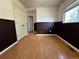 Bedroom with double doors leading to a closet and laminate flooring at 7958 Downing St, Denver, CO 80229