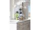 Modern kitchen featuring a white island, pendant lighting, and a sleek faucet at 10848 Lyric St, Lone Tree, CO 80134