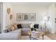 Bright and airy living room with a comfortable sectional sofa and a coffee table at 10848 Lyric St, Lone Tree, CO 80134