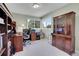 Home office with built-in bookshelves and a large desk at 9169 Sugarstone Cir, Highlands Ranch, CO 80130