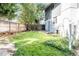 Spacious backyard with grassy area and wooden fence at 3790 S Roslyn Way, Denver, CO 80237
