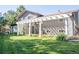 House exterior showcasing a pergola and grassy yard at 3790 S Roslyn Way, Denver, CO 80237