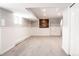 Finished basement with neutral carpet and added storage at 3790 S Roslyn Way, Denver, CO 80237