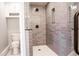 Updated bathroom with walk-in shower, toilet and modern vanity at 3790 S Roslyn Way, Denver, CO 80237