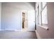 Bedroom with ensuite bathroom and large windows at 3790 S Roslyn Way, Denver, CO 80237