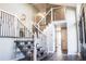 Elegant entryway with a modern staircase and hardwood floors at 3790 S Roslyn Way, Denver, CO 80237