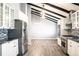 Modern kitchen with stainless steel appliances and granite countertops at 3790 S Roslyn Way, Denver, CO 80237