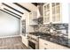 Modern kitchen with stainless steel appliances and granite countertops at 3790 S Roslyn Way, Denver, CO 80237