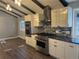 Modern kitchen with stainless steel appliances and granite countertops at 3790 S Roslyn Way, Denver, CO 80237