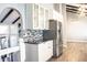 Modern kitchen with stainless steel appliances and granite countertops at 3790 S Roslyn Way, Denver, CO 80237