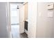 Main floor laundry room with washer and dryer hookups and built in shelving at 3790 S Roslyn Way, Denver, CO 80237