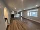 Spacious living room with hardwood floors and an arched doorway at 3790 S Roslyn Way, Denver, CO 80237