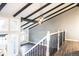 Elegant staircase with wrought iron railing and hardwood flooring at 3790 S Roslyn Way, Denver, CO 80237