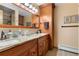 Bathroom with double vanity and granite countertop at 9941 Ammons Cir, Broomfield, CO 80021