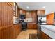 Modern kitchen with stainless steel appliances and wood cabinetry at 9941 Ammons Cir, Broomfield, CO 80021