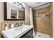 Bathroom with tiled shower and updated vanity at 9941 Ammons Cir, Broomfield, CO 80021