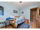 Bedroom with twin bed and light blue walls at 9941 Ammons Cir, Broomfield, CO 80021