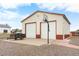 Large detached garage with double doors and basketball hoop at 9941 Ammons Cir, Broomfield, CO 80021
