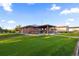 Spacious backyard with large lawn and covered patio at 9941 Ammons Cir, Broomfield, CO 80021