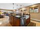 Kitchen with large island, stainless steel appliances, and a farmhouse sink at 9941 Ammons Cir, Broomfield, CO 80021