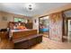 Main bedroom with wood furniture and large mirrored closet at 9941 Ammons Cir, Broomfield, CO 80021