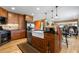 Spacious kitchen featuring a large island, stainless steel appliances, and ample wood cabinetry at 9941 Ammons Cir, Broomfield, CO 80021
