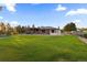 Spacious backyard with grassy lawn and home at 9941 Ammons Cir, Broomfield, CO 80021