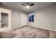 Light grey bedroom with ceiling fan and window at 9307 Inca Dove Cir, Littleton, CO 80125