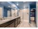 Bathroom with shower and double vanity at 9307 Inca Dove Cir, Littleton, CO 80125