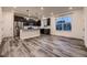 Open concept kitchen with island and stainless steel appliances at 9307 Inca Dove Cir, Littleton, CO 80125