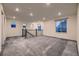 Spacious loft area with carpet and multiple windows offering natural light at 9307 Inca Dove Cir, Littleton, CO 80125