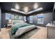 Main bedroom with a teal and white bedding set and ceiling fan at 9307 Inca Dove Cir, Littleton, CO 80125