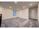 Bright loft space featuring carpet, a window, and access to other rooms at 9307 Inca Dove Cir, Littleton, CO 80125